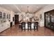 Large kitchen featuring a wood-topped island with seating, white cabinetry, and terracotta floors at 2041 W Hemlock Way, Chandler, AZ 85248