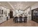 Spacious kitchen with a large central island, custom cabinets, and modern pendant lighting at 2041 W Hemlock Way, Chandler, AZ 85248