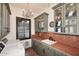 This laundry room has custom cabinetry and tile countertops and backsplash at 2041 W Hemlock Way, Chandler, AZ 85248