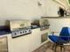 Outdoor kitchen featuring stainless steel grill, blue tile counter, and additional seating at 2041 W Hemlock Way, Chandler, AZ 85248