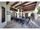 Spacious covered patio with exposed wood beams and an inviting dining area at 2041 W Hemlock Way, Chandler, AZ 85248