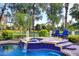 Relaxing pool with waterfall feature, lounge chairs, and beautifully landscaped surroundings at 2041 W Hemlock Way, Chandler, AZ 85248