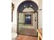 The glass enclosed shower features custom tile work, two shower heads and ceramic tile flooring at 2041 W Hemlock Way, Chandler, AZ 85248