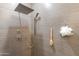 Spa-like shower with rainfall showerhead, hand shower, and gray tile surround at 20713 N 91St Dr, Peoria, AZ 85382