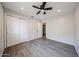Bedroom with ceiling fan, closet and view into en suite bathroom at 20802 N 7Th Pl, Phoenix, AZ 85024