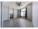 Bright bedroom featuring ensuite bathroom, ceiling fan and hardwood floors at 20802 N 7Th Pl, Phoenix, AZ 85024