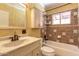 Bathroom with decorative tile, vanity, and shower-tub combo at 2213 E Campbell Ave, Phoenix, AZ 85016