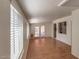 Sunlit living room with wood floors and access to the backyard through glass doors at 2213 E Campbell Ave, Phoenix, AZ 85016
