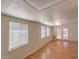 Bright living room with wood floors and access to the backyard through glass doors at 2213 E Campbell Ave, Phoenix, AZ 85016