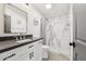 Modern bathroom featuring a vessel sink, black countertop, and tiled shower with glass enclosure at 2321 N 30Th St, Phoenix, AZ 85008
