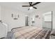 A bedroom with neutral tones, carpet floors, and a ceiling fan, offering a relaxing atmosphere at 2321 N 30Th St, Phoenix, AZ 85008