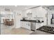 Stylish kitchen featuring white cabinetry, stainless steel appliances, and dark countertops at 2321 N 30Th St, Phoenix, AZ 85008