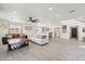 Open-concept living area showcases stylish tile floors, a modern ceiling fan, and plenty of natural light at 2321 N 30Th St, Phoenix, AZ 85008