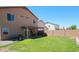 Backyard features a covered patio and green lawn at 2434 E San Manuel Rd, San Tan Valley, AZ 85143
