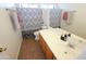 Bathroom with shower curtain and tile flooring, and a vanity and sink with mirrored wall at 2434 E San Manuel Rd, San Tan Valley, AZ 85143