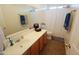Bright bathroom features modern vanity with single sink, countertop space, and framed mirror at 2434 E San Manuel Rd, San Tan Valley, AZ 85143