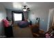 Bedroom featuring gray walls and carpeted floors with furniture and a ceiling fan for optimal comfort at 2434 E San Manuel Rd, San Tan Valley, AZ 85143