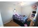 Charming bedroom features a ceiling fan, carpet, natural light, and neutral walls at 2434 E San Manuel Rd, San Tan Valley, AZ 85143