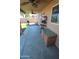 Inviting covered patio offers a comfortable space for outdoor dining and entertaining with access to backyard at 2434 E San Manuel Rd, San Tan Valley, AZ 85143