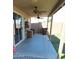 Inviting covered patio features ceiling fans, access to the home, and views of the backyard with block wall for privacy at 2434 E San Manuel Rd, San Tan Valley, AZ 85143
