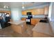Well-lit kitchen featuring wood cabinets, laminate countertops, and a black appliance package at 2434 E San Manuel Rd, San Tan Valley, AZ 85143