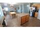 Open kitchen features an island, stainless steel appliances, and an adjacent dining area at 2434 E San Manuel Rd, San Tan Valley, AZ 85143