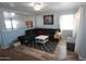 Comfortable living room with a large sectional sofa and a gray accent rug on wood-look flooring at 2434 E San Manuel Rd, San Tan Valley, AZ 85143