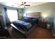 Spacious main bedroom with ceiling fan, ensuite bathroom, natural light, and neutral walls at 2434 E San Manuel Rd, San Tan Valley, AZ 85143
