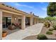 Large back patio featuring multiple seating areas with desert landscaping at 27953 N 111Th Way, Scottsdale, AZ 85262