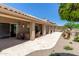 Expansive backyard featuring a covered patio, a built-in grill, and mature trees for shade at 27953 N 111Th Way, Scottsdale, AZ 85262