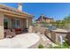 Charming backyard with a built-in barbecue, covered patio seating, and well-manicured landscaping at 27953 N 111Th Way, Scottsdale, AZ 85262