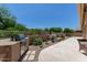 Picturesque backyard featuring a built-in grill, a water feature, and lush landscaping at 27953 N 111Th Way, Scottsdale, AZ 85262