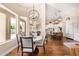 Cozy dining area with a view to the kitchen and a marble table at 27953 N 111Th Way, Scottsdale, AZ 85262