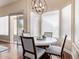 Bright dining area featuring large windows, a round table, and modern lighting at 27953 N 111Th Way, Scottsdale, AZ 85262