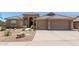 Stunning single-story home boasting a spacious three-car garage and beautiful desert landscaping at 27953 N 111Th Way, Scottsdale, AZ 85262