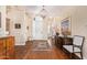 Elegant foyer with hardwood floors, a chandelier, and artwork creating a grand entrance at 27953 N 111Th Way, Scottsdale, AZ 85262