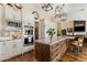 Kitchen with a large island, modern appliances, and pendant lighting at 27953 N 111Th Way, Scottsdale, AZ 85262