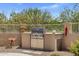 Built-in outdoor grill area with stainless steel grill and prep space at 27953 N 111Th Way, Scottsdale, AZ 85262