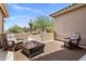 Outdoor patio space with comfortable seating and a cozy fire pit at 27953 N 111Th Way, Scottsdale, AZ 85262