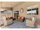Inviting covered patio with wicker furniture and patterned rug at 27953 N 111Th Way, Scottsdale, AZ 85262