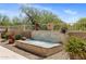 Attractive stone water feature surrounded by landscaping at 27953 N 111Th Way, Scottsdale, AZ 85262