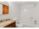 Bathroom featuring a shower-tub combo, single sink vanity, and a tiled floor at 286 W Palomino Dr # 103, Chandler, AZ 85225