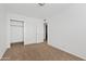 This carpeted bedroom features a closet for storage and a neutral walls at 286 W Palomino Dr # 103, Chandler, AZ 85225