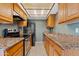 Well-equipped kitchen with granite countertops, stainless steel appliances, and ample cabinet space at 286 W Palomino Dr # 103, Chandler, AZ 85225