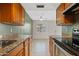 Charming kitchen featuring granite countertops, stainless steel appliances, and tile flooring at 286 W Palomino Dr # 103, Chandler, AZ 85225