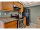 Efficient kitchen featuring stainless steel range, granite counters, and ample storage at 286 W Palomino Dr # 103, Chandler, AZ 85225