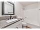 Bathroom featuring updated vanity with quartz countertops and shower at 3026 W Ross Ave, Phoenix, AZ 85027