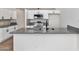 Modern kitchen featuring an island with a sink, white cabinets, and stainless steel appliances at 3026 W Ross Ave, Phoenix, AZ 85027