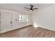Bright living room showcasing wood floors, large window, and neutral paint at 3026 W Ross Ave, Phoenix, AZ 85027