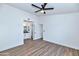 Spacious main bedroom featuring wood floors, neutral paint, and an ensuite bathroom at 3026 W Ross Ave, Phoenix, AZ 85027